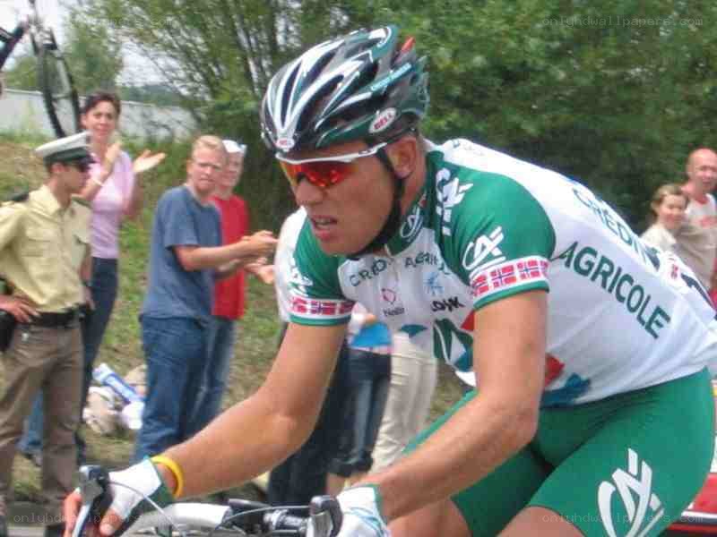 cyclist in green and white jersey