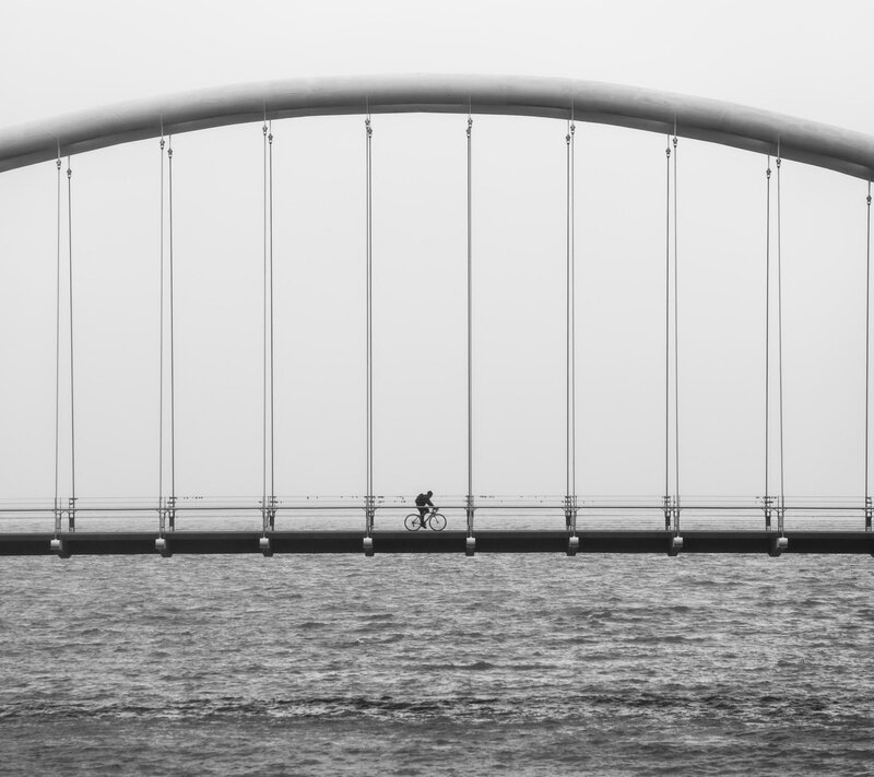 Cyclist on a Bridge — Black, Serene