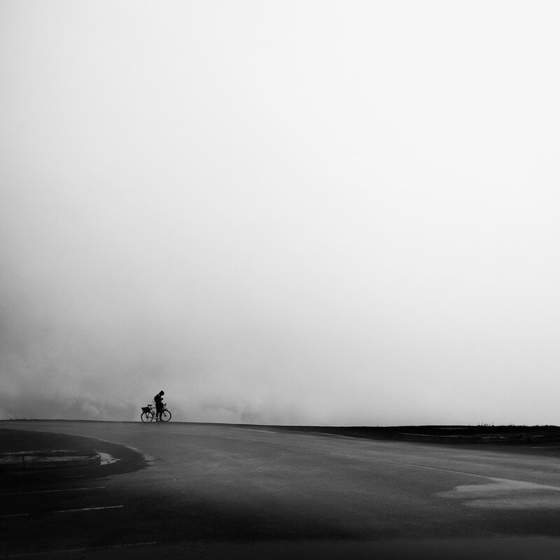 Cyclist on a foggy road
