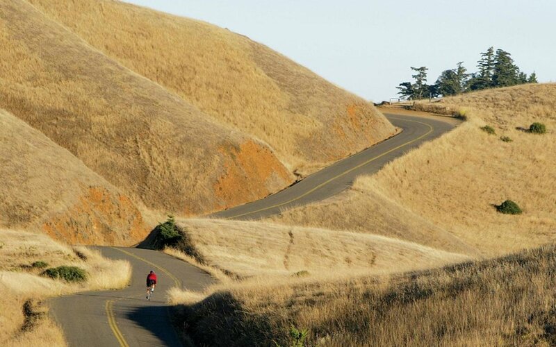 Cyclist on a winding road