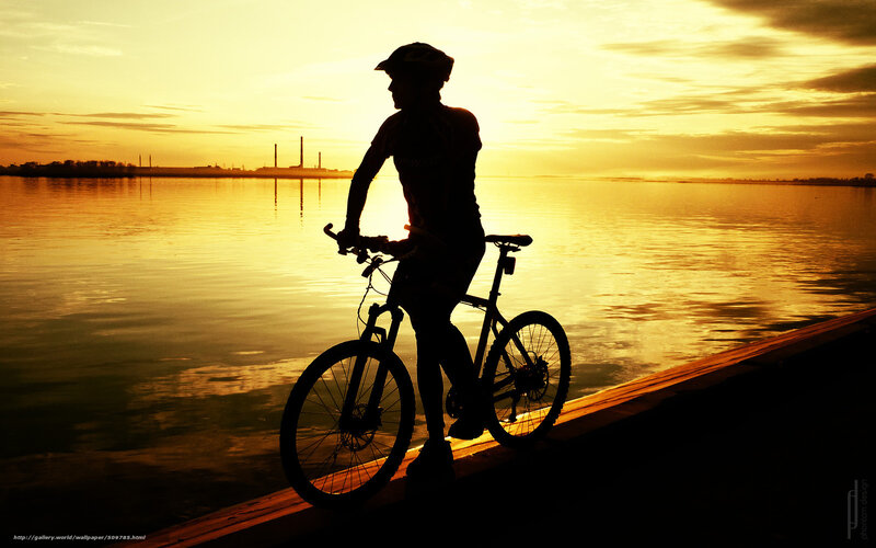 Cyclist on Bike at Sunset