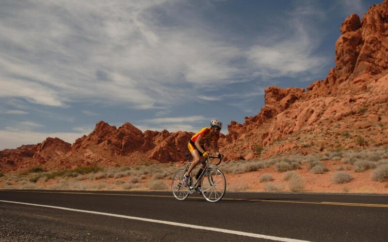 Cyclist on desert road
