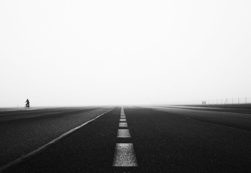 Cyclist on Foggy Road — Black