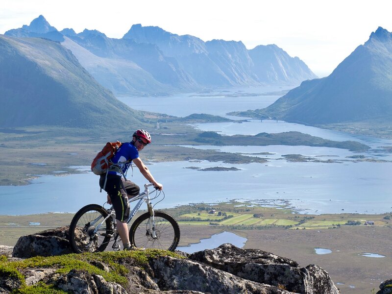 Cyclist on Mountain Peak