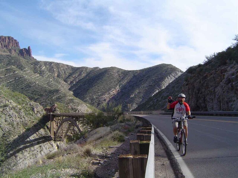 Cyclist on Mountain Road — Blue