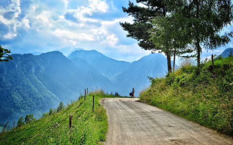 Cyclist on Mountain Road — Green, Serene
