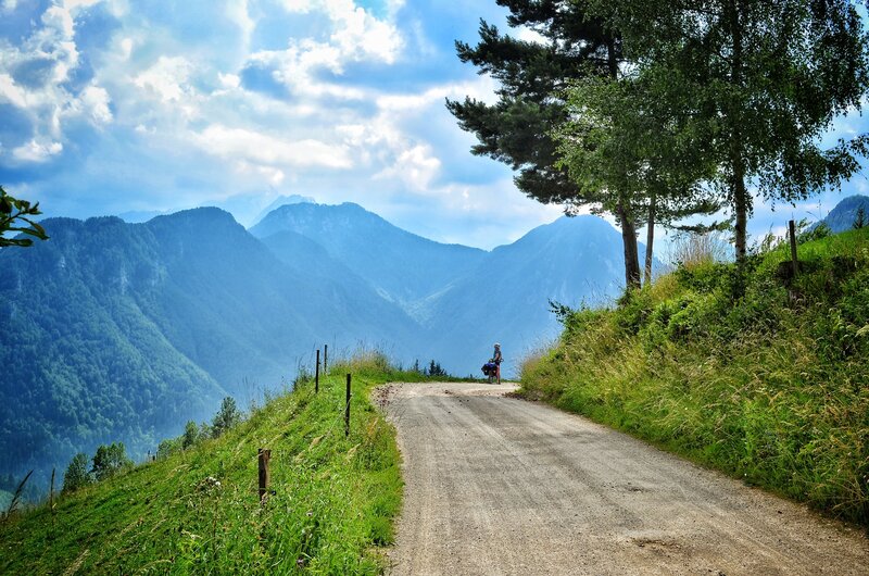 Cyclist on Mountain Road — Green