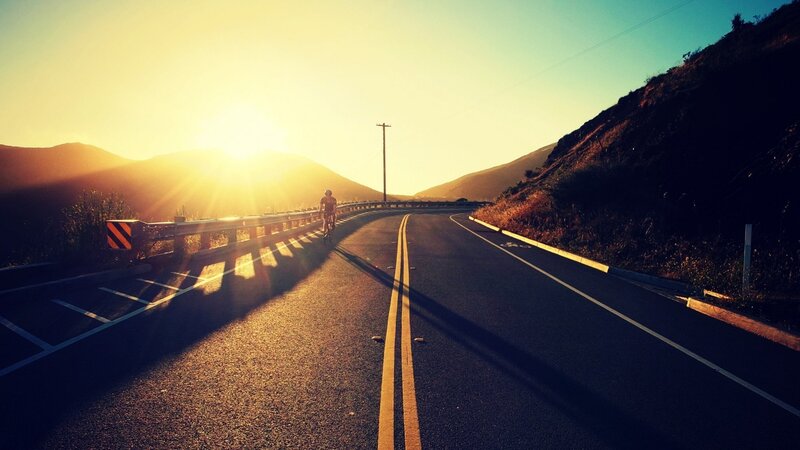 Cyclist on Mountain Road — Yellow
