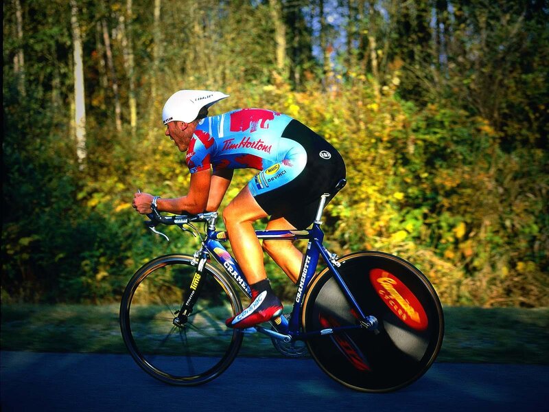 Cyclist on Road Bike — Blue, Focused, Afternoon, Photograph, Forest