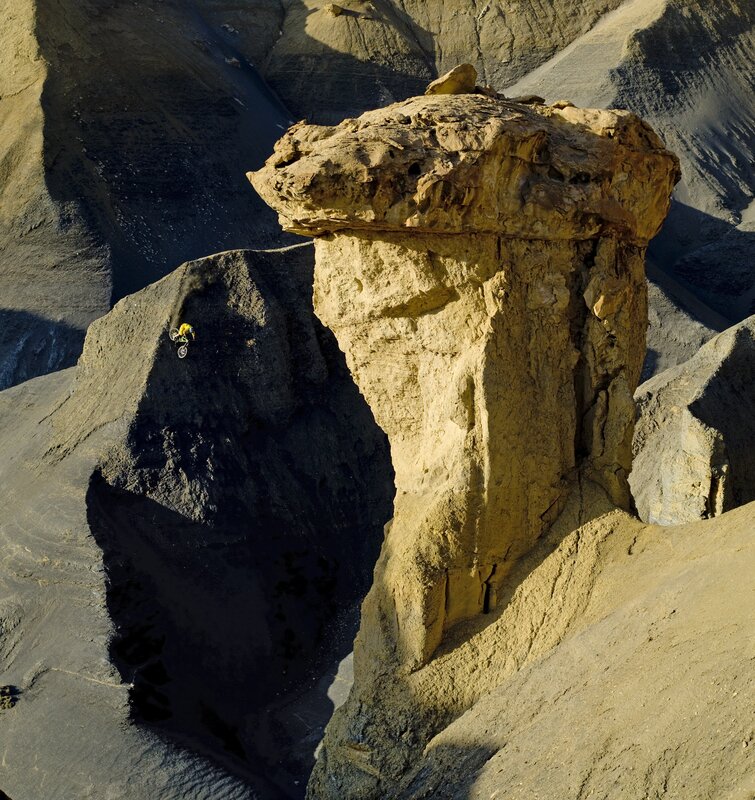 Cyclist on Rocky Terrain — Brown