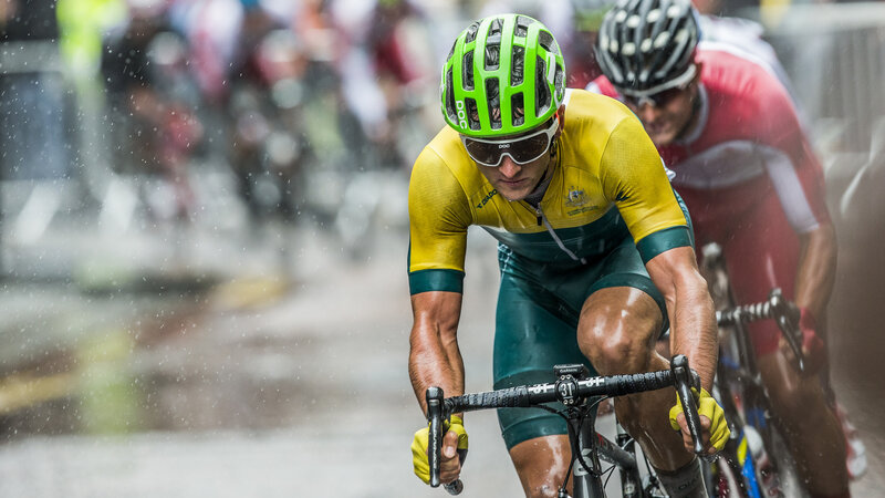 Cyclist racing in rain