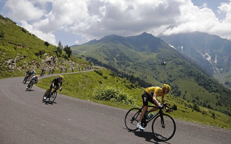 Cyclists climbing a mountain