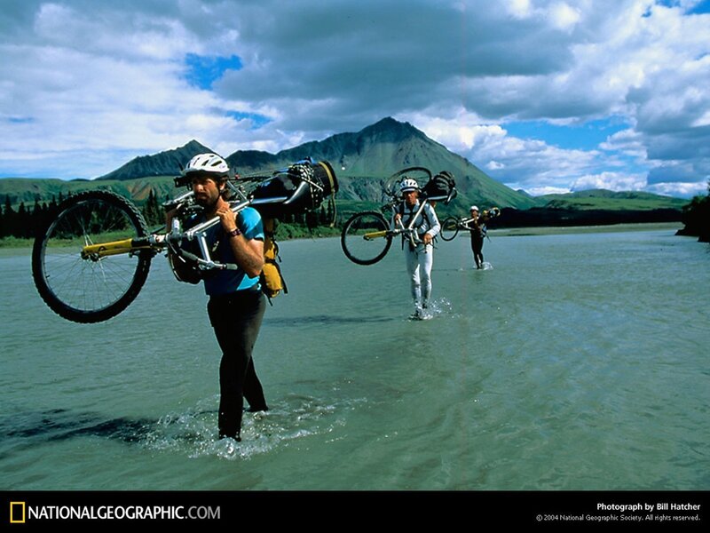 Cyclists crossing a river