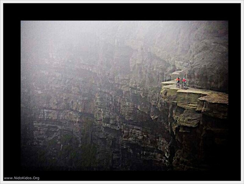Cyclists on a cliff edge