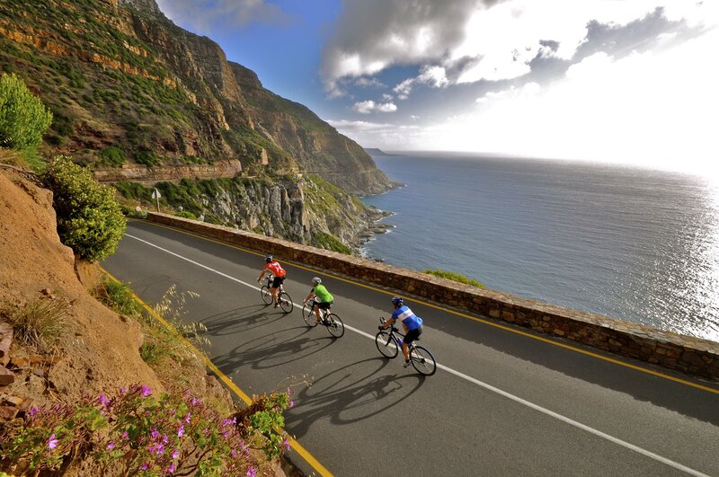 Cyclists on Coastal Road — Blue, Dramatic