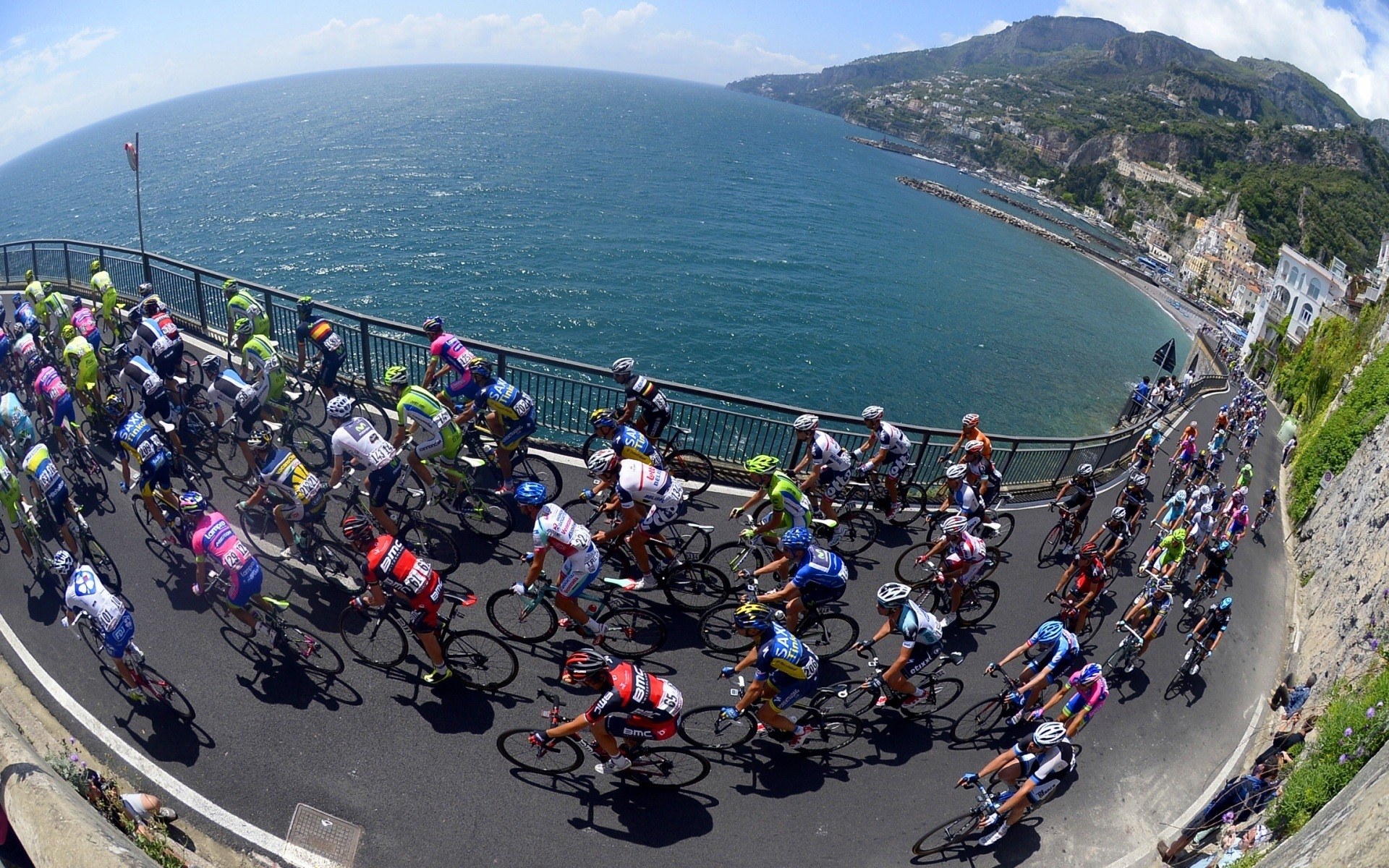 Cyclists racing along coastal road