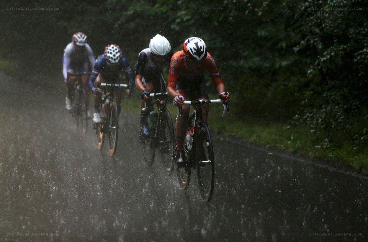 Cyclists racing in the rain