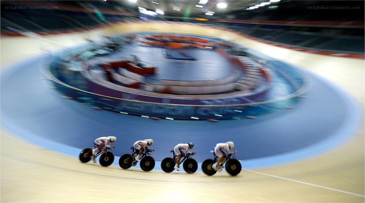 Cyclists racing on velodrome