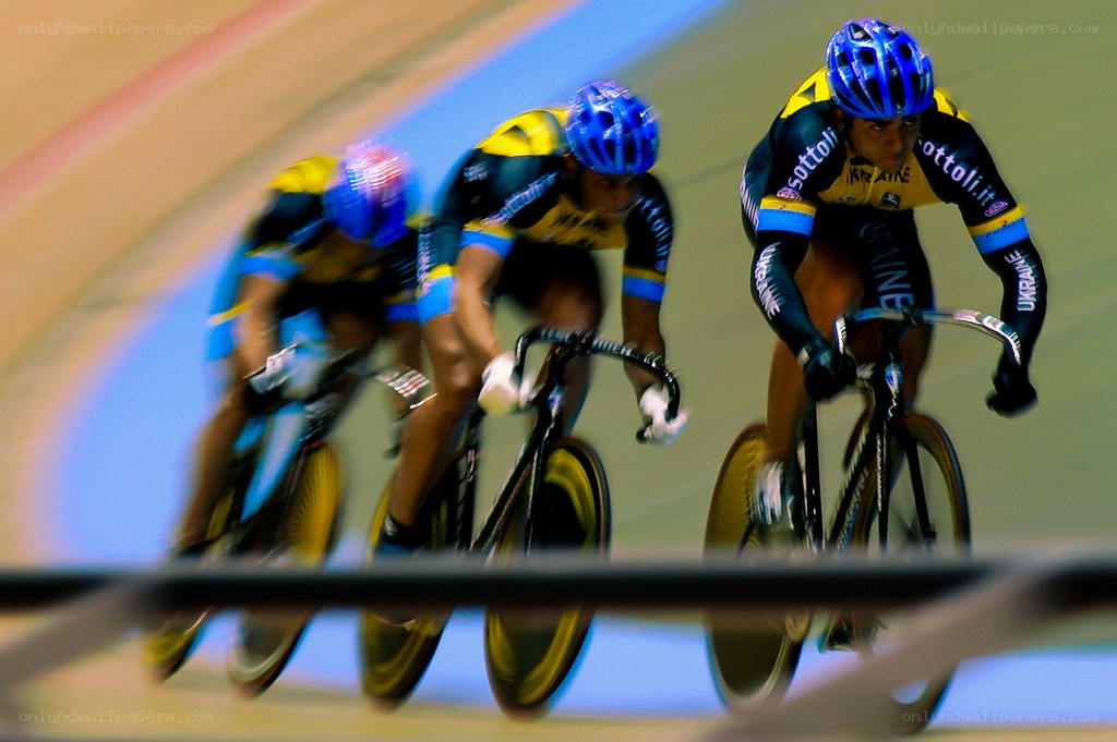 Cyclists racing on velodrome