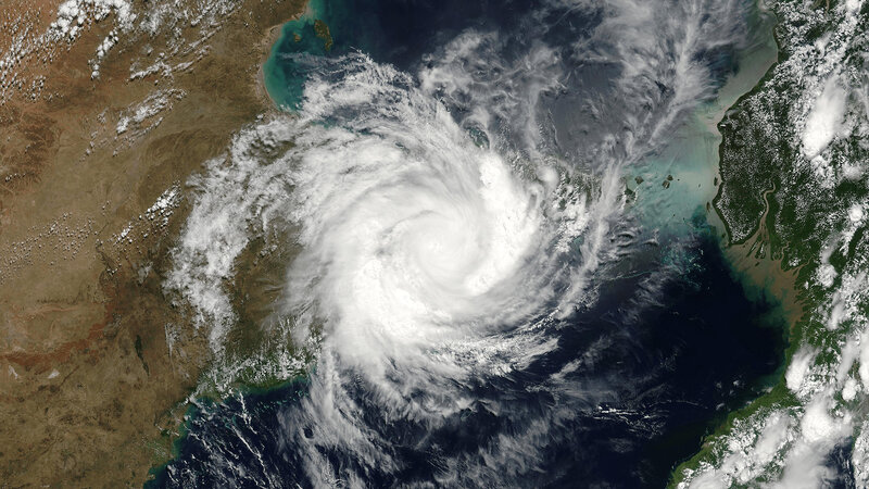 Cyclone over Land and Sea
