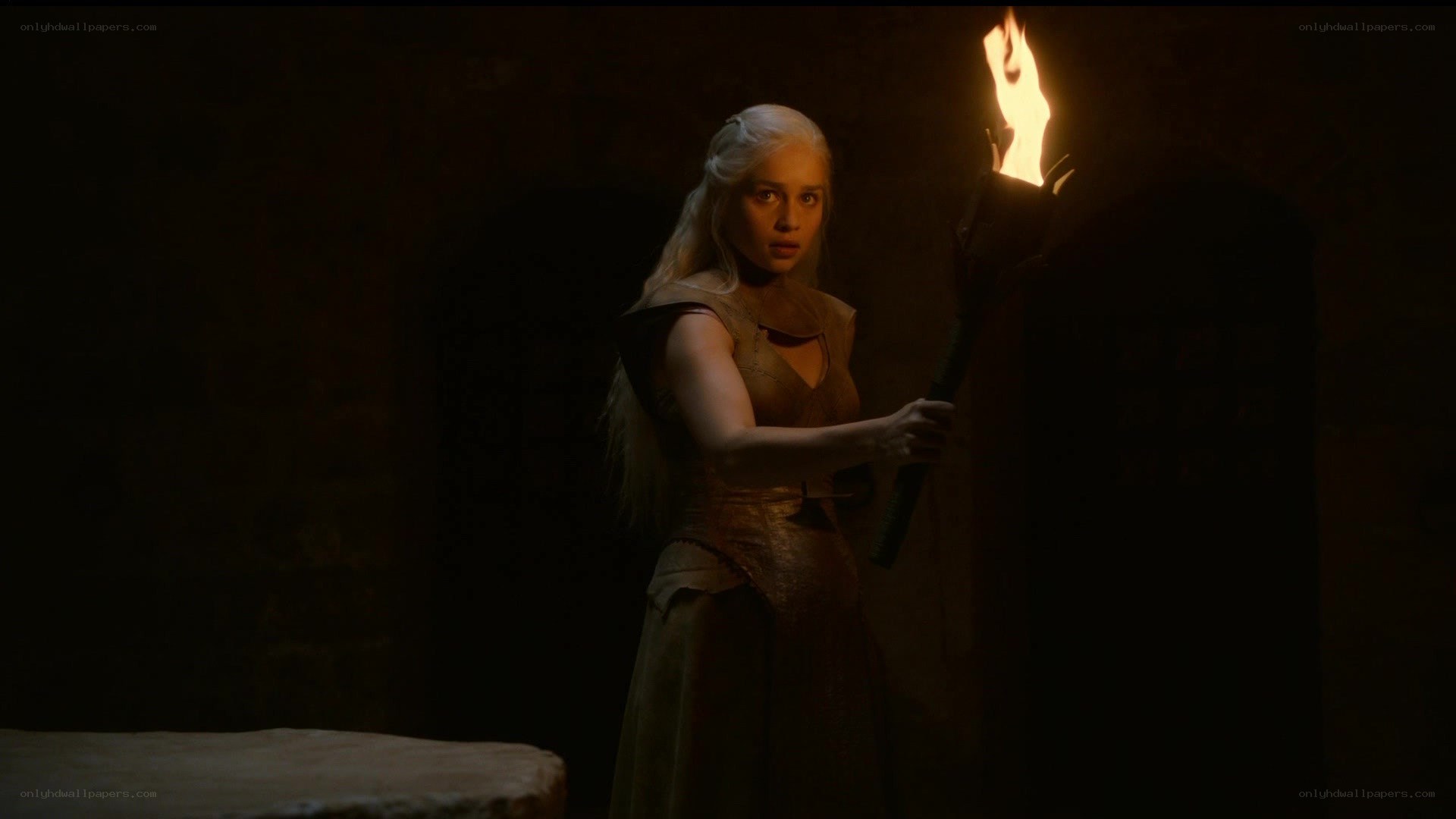 Daenerys with torch in dark room