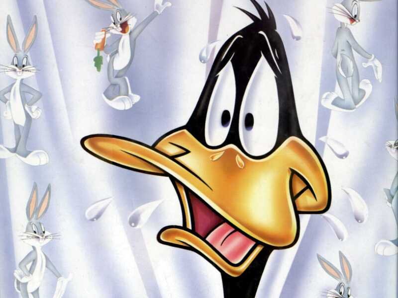 Daffy Duck surrounded by Bugs Bunny