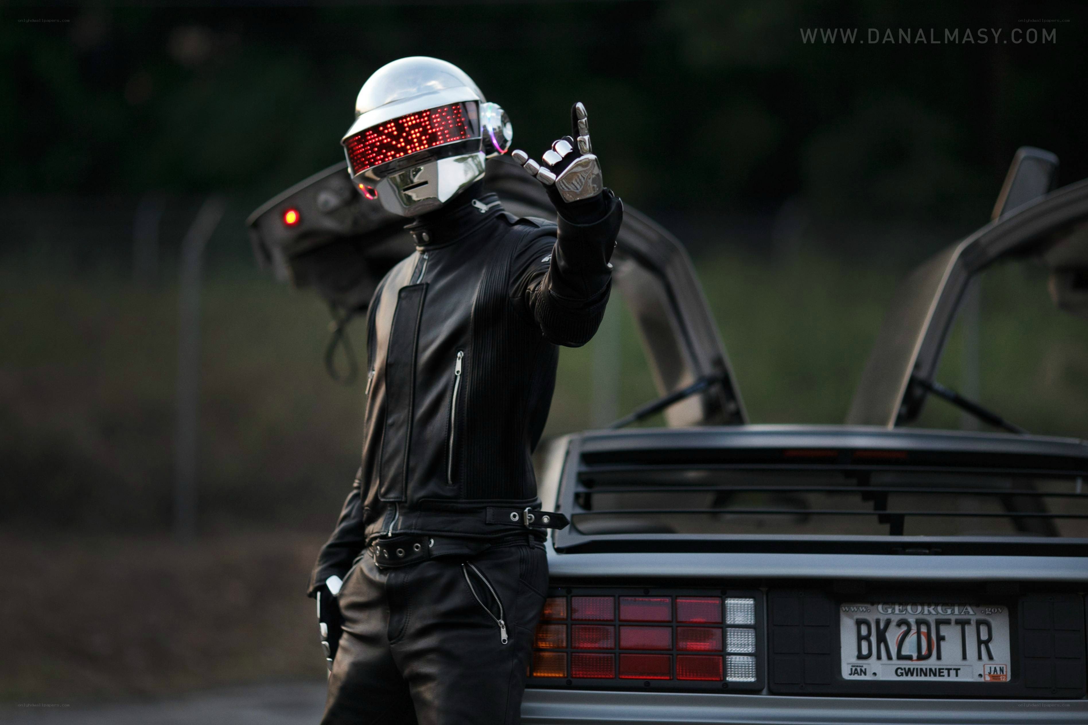 Daft Punk cosplayer with DeLorean
