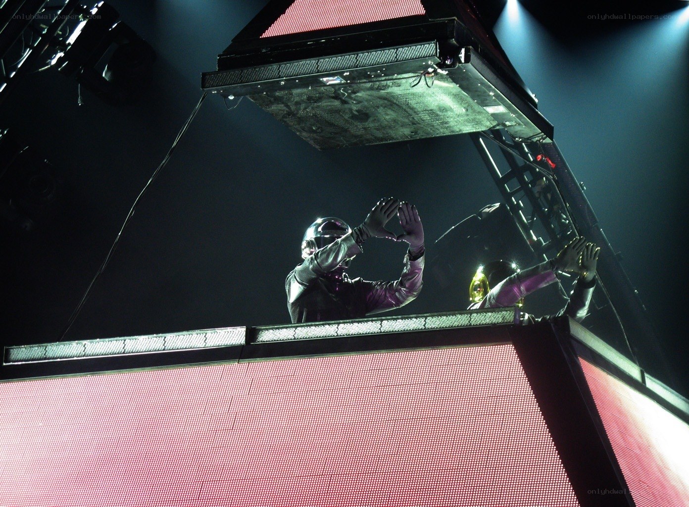 Daft Punk performing on stage