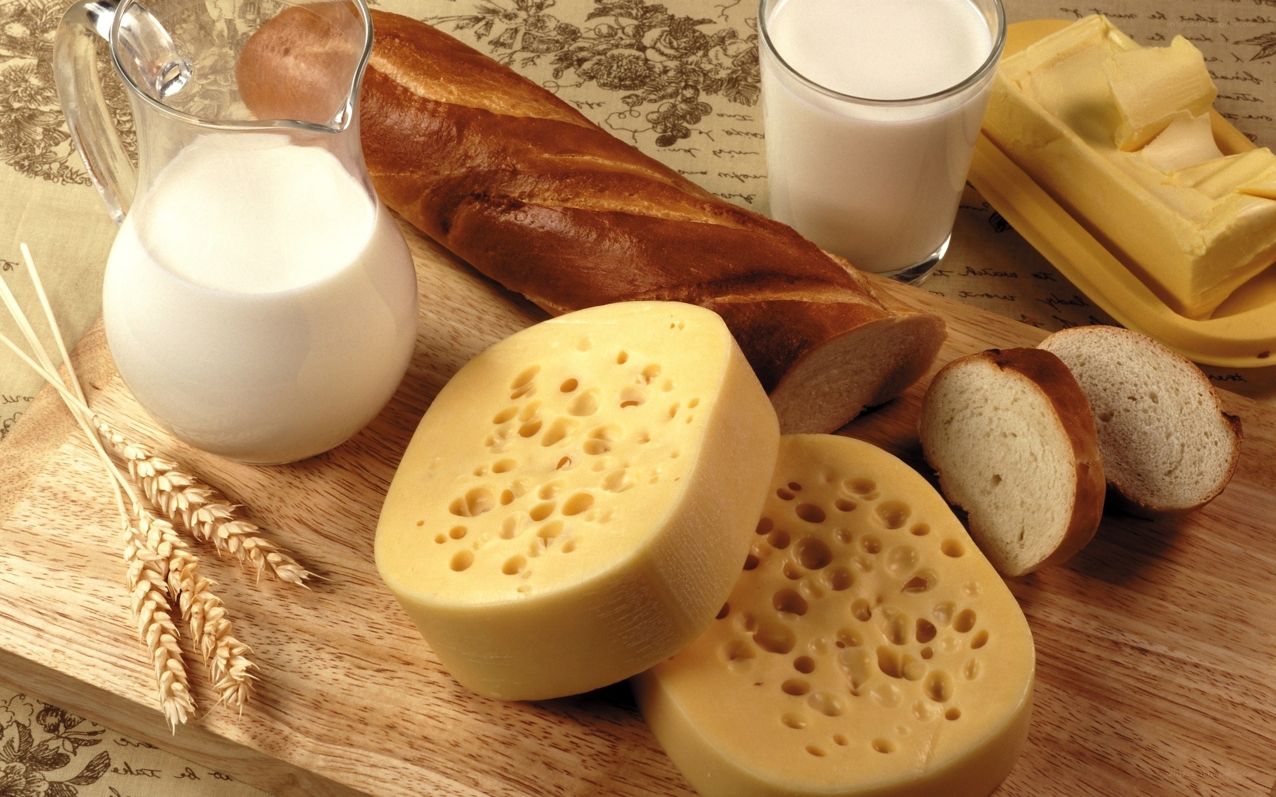 dairy and bread on wooden board