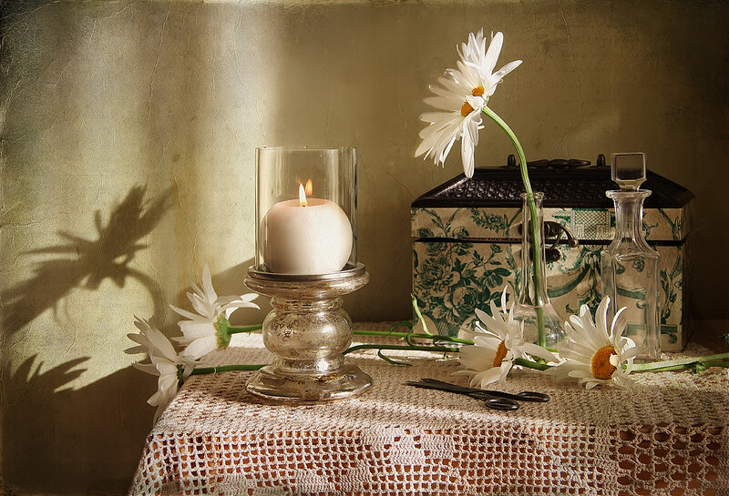 Daisies and Candle on Table