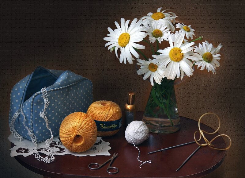 Daisies and Yarn on Table