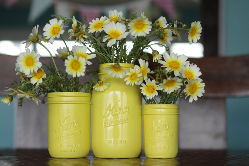Daisies in Yellow Jars
