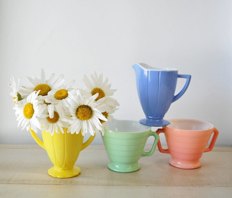 Daisies in Yellow Pitcher