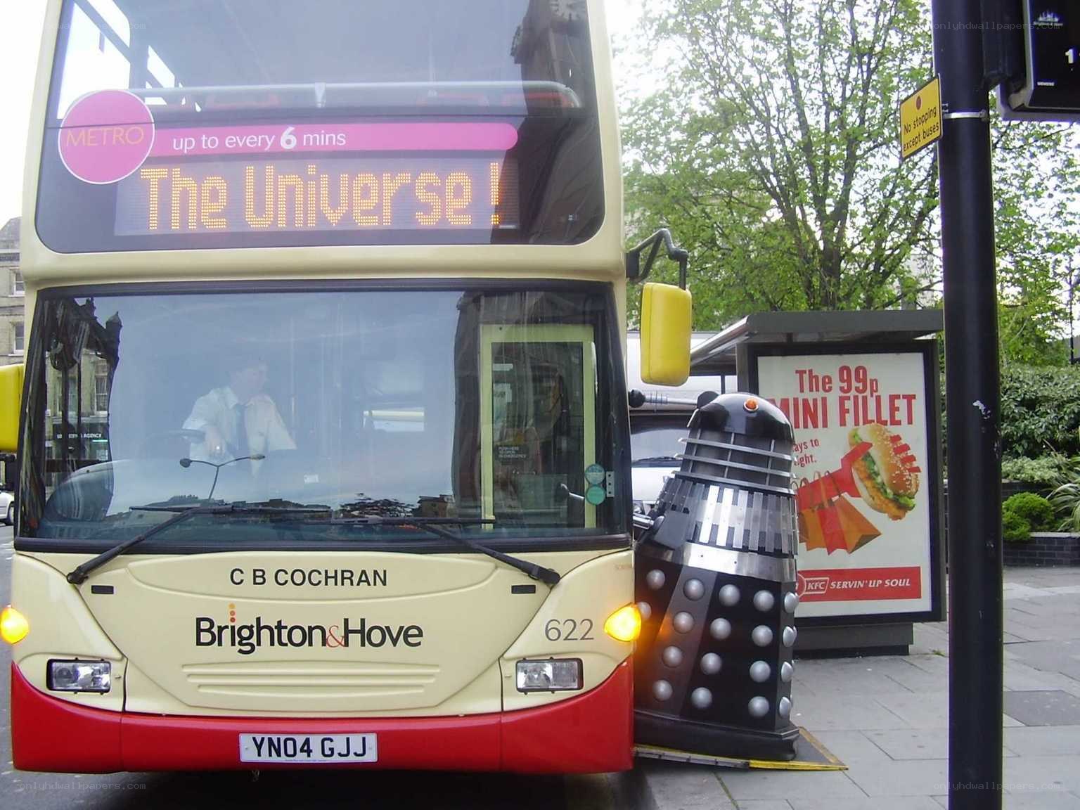 Dalek next to double-decker bus