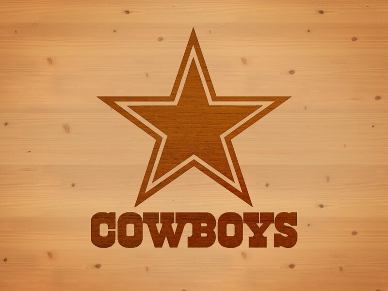 Dallas Cowboys logo on wood
