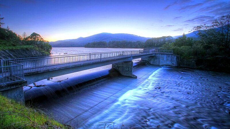 Dam at dusk with flowing water