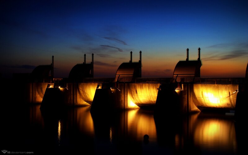 Dam at dusk with illuminated lights