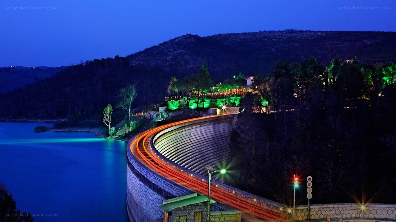 Dam at night with light trails