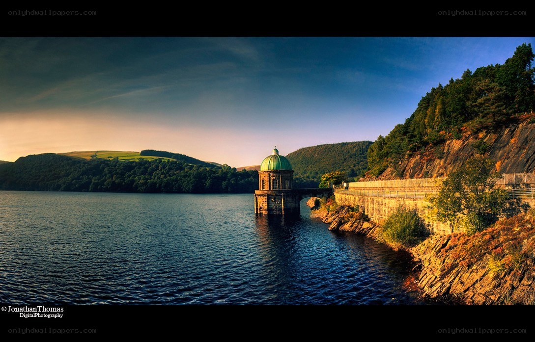 Dam at sunset with green dome