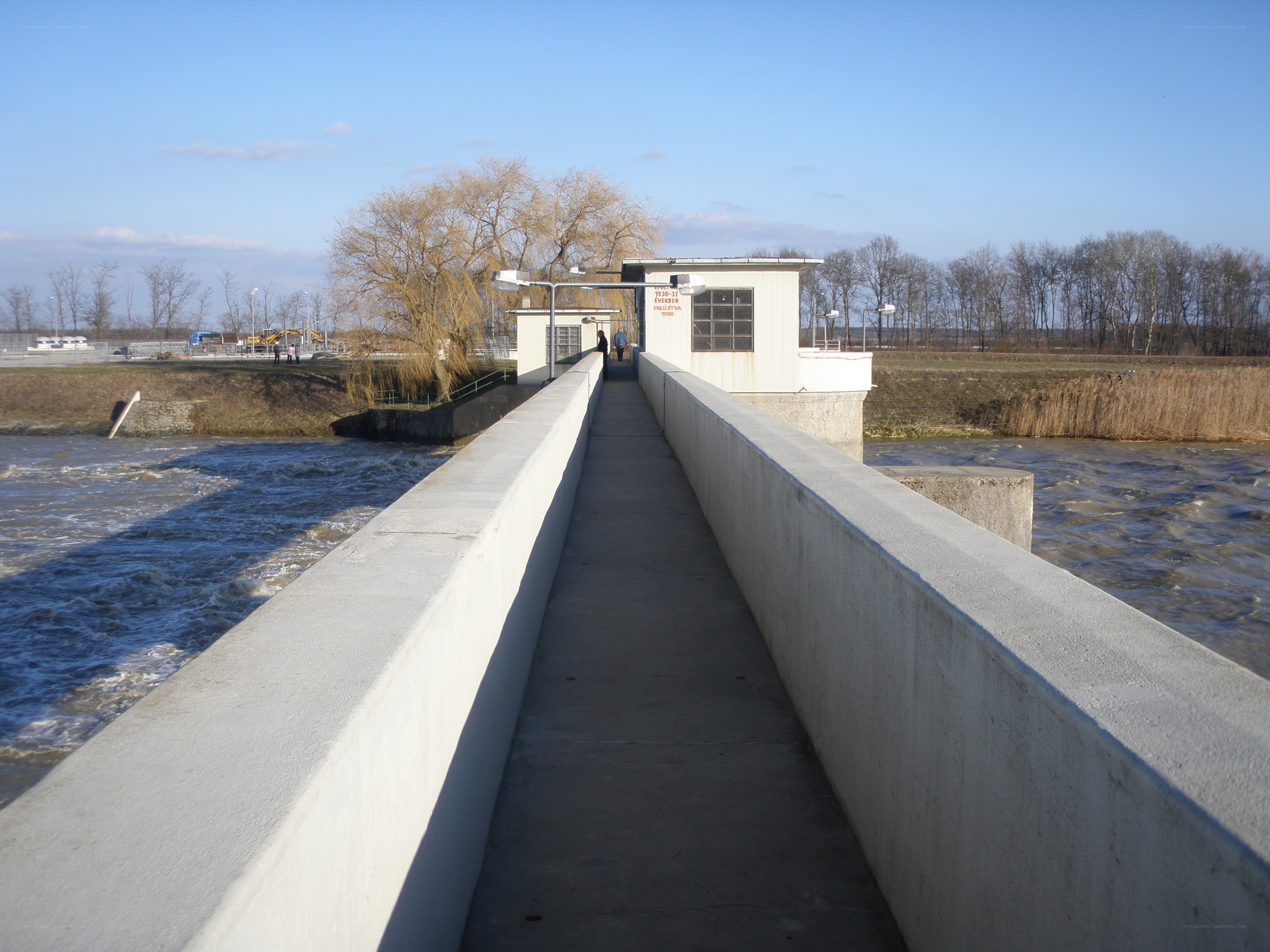 Dam walkway with river flow