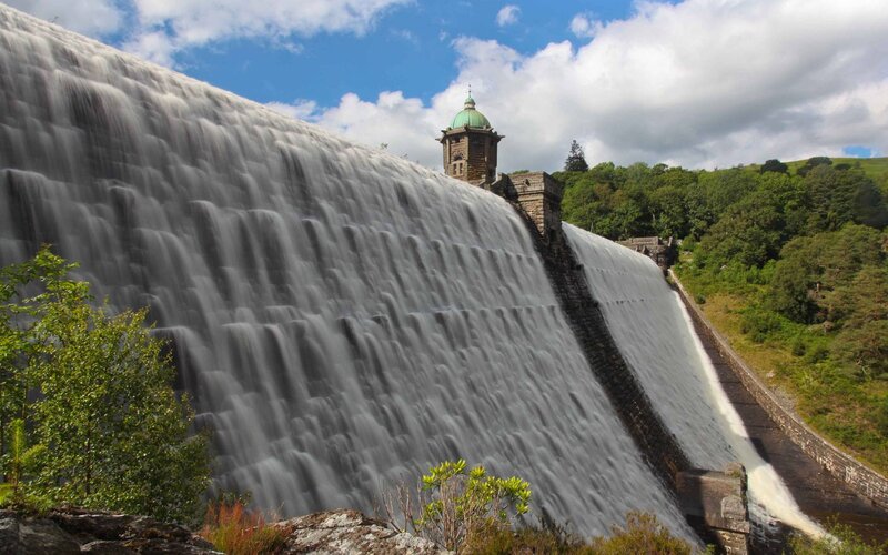 Dam with Water Flowing — Blue, Dramatic