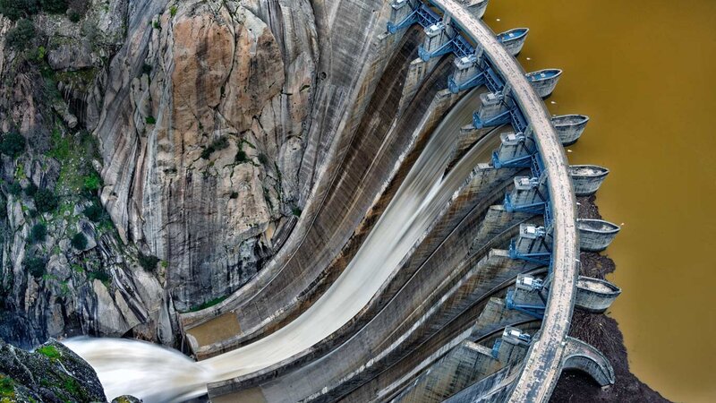 Dam with Water Flowing — Brown, Dramatic