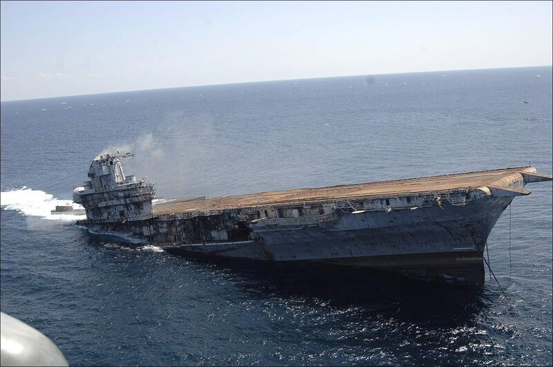 Damaged aircraft carrier at sea