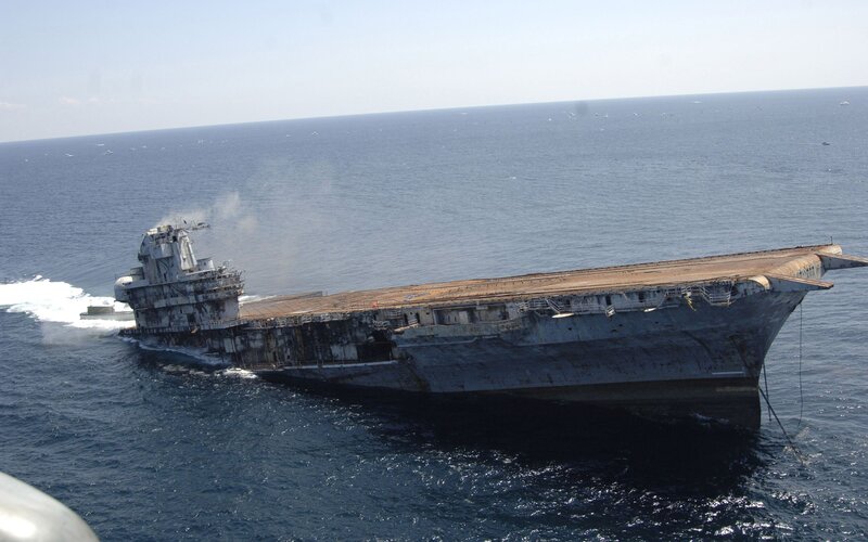 Damaged aircraft carrier at sea