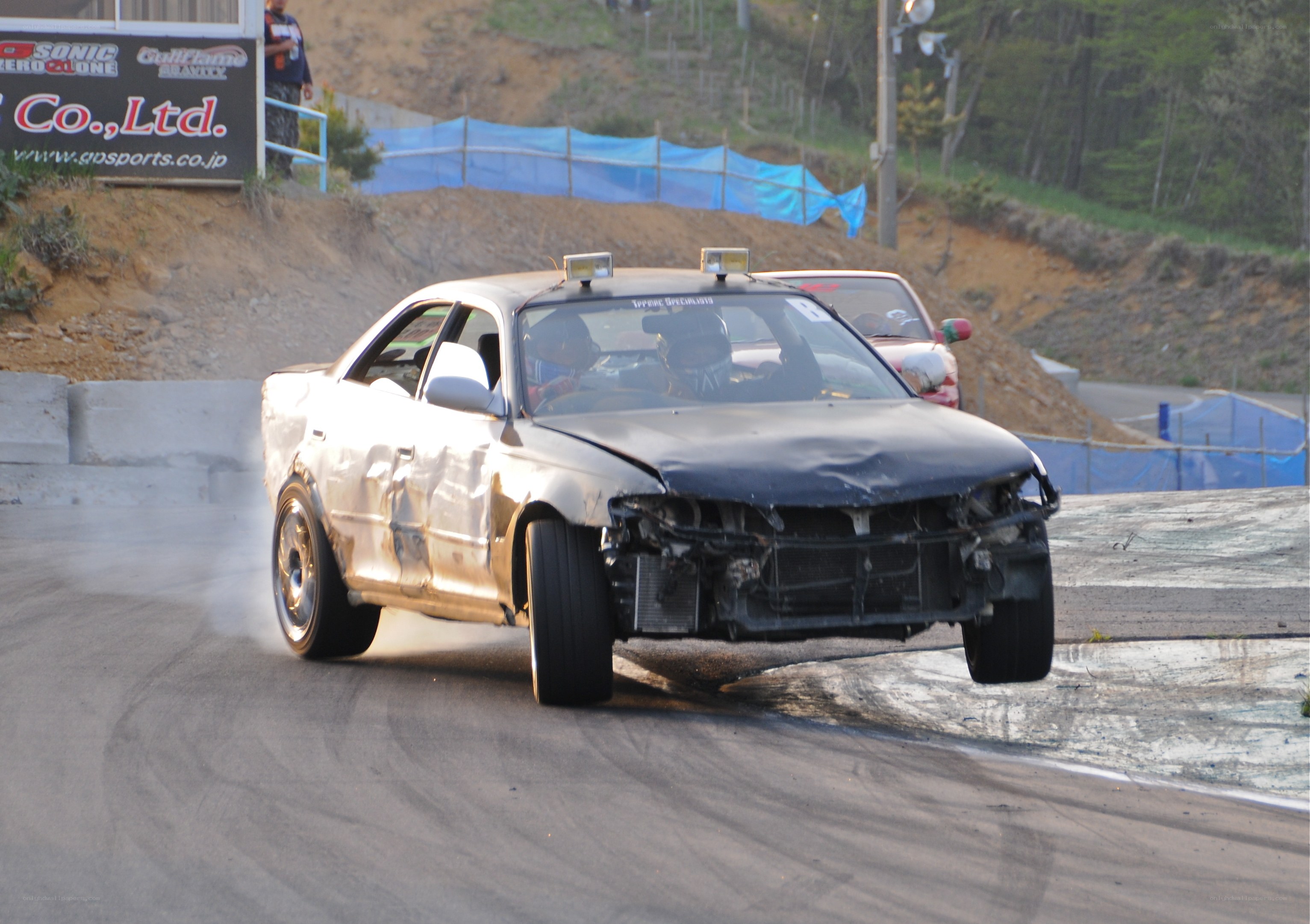 Damaged car drifting on track