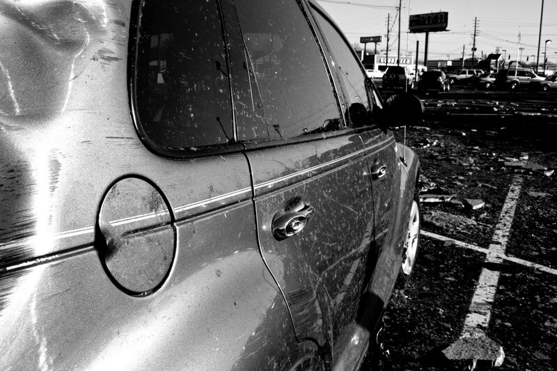 damaged car in parking lot