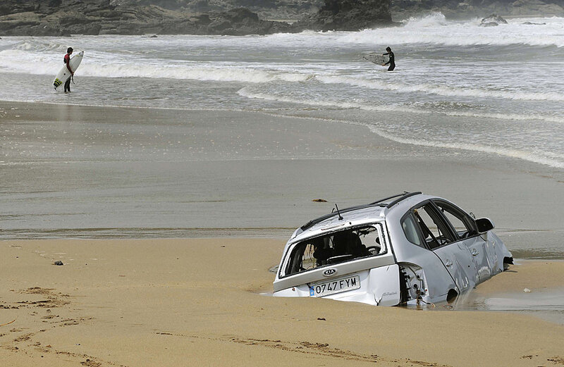 Damaged Car on Beach