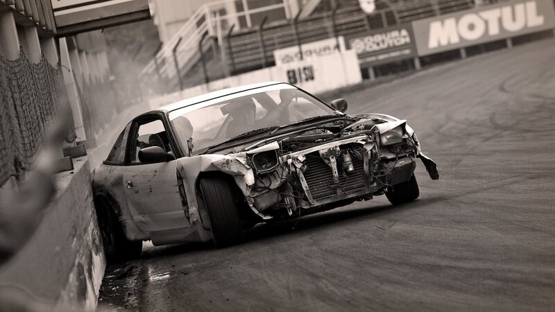 Damaged car on racetrack