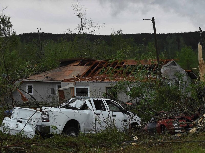 Damaged House and Vehicles