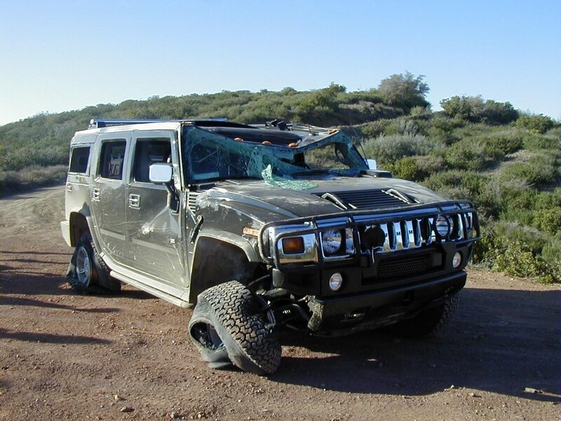 Damaged Hummer on dirt road